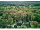 Overhead shot of lush property with mature trees and neighboring golf course, offering privacy at 901 Center Dr, Noblesville, IN 46060