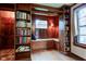 Charming library nook featuring custom bookshelves, a window seat, and cozy lighting at 901 Center Dr, Noblesville, IN 46060