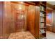 Inviting entryway with beautiful wood paneling, tile flooring, and convenient built-in storage at 901 Center Dr, Noblesville, IN 46060