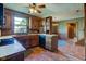 Functional kitchen with wood cabinets, appliances, and a tiled floor, perfect for cooking at 901 Center Dr, Noblesville, IN 46060