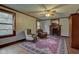 Cozy living room features a fireplace, classic rug, ceiling fan and plenty of natural light at 901 Center Dr, Noblesville, IN 46060