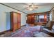 Spacious living room with wood floors, and an accent with built-in bookshelves and a window seat at 901 Center Dr, Noblesville, IN 46060