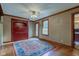 Comfortable living room featuring hardwood floors, built-in cabinet, ceiling fan, and an area rug at 901 Center Dr, Noblesville, IN 46060