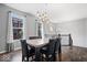 Elegant dining room featuring stylish lighting and a modern table with comfortable seating, perfect for gatherings at 9422 Oakley Dr, Indianapolis, IN 46260