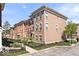 Beautiful brick townhome exterior featuring manicured landscaping at 9422 Oakley Dr, Indianapolis, IN 46260
