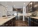 Well-equipped kitchen featuring granite countertops, stainless steel appliances, and dark wood cabinetry offering modern elegance at 9422 Oakley Dr, Indianapolis, IN 46260