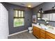 Stylish bathroom with a wood vanity, decorative mirror and tub-shower at 950 Hearthside Dr, Brownsburg, IN 46112
