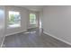 Cozy bedroom featuring two large windows and light grey walls at 950 Hearthside Dr, Brownsburg, IN 46112