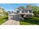 Charming two-story home with a well-maintained lawn, two-car garage, and traditional design elements at 950 Hearthside Dr, Brownsburg, IN 46112