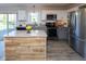 Updated kitchen featuring stainless steel appliances, ample counter space, and modern cabinetry at 950 Hearthside Dr, Brownsburg, IN 46112