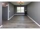 Living room with hardwood floors, a window, and neutral wall paint at 950 Hearthside Dr, Brownsburg, IN 46112