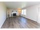 Spacious living room featuring hardwood floors, a fireplace, and natural light from the windows at 950 Hearthside Dr, Brownsburg, IN 46112
