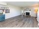Bright living room featuring hardwood floors, a fireplace, and stylish decor at 950 Hearthside Dr, Brownsburg, IN 46112