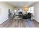 Bright living room featuring hardwood floors, a fireplace, and a comfortable seating area at 950 Hearthside Dr, Brownsburg, IN 46112