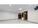 Unfinished basement features tile flooring and built-in shelving at 960 Arrowwood Dr, Carmel, IN 46033