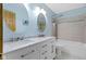 Bathroom with dual sinks, oval mirrors and shower and tub at 960 Arrowwood Dr, Carmel, IN 46033