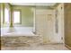 Bathroom with a tub and stand up shower with stone detail at 960 Arrowwood Dr, Carmel, IN 46033