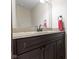 Bathroom vanity features dark wood cabinets and a granite countertop at 960 Arrowwood Dr, Carmel, IN 46033
