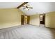 Bedroom with a vaulted ceiling, fan, and multiple entry doors at 960 Arrowwood Dr, Carmel, IN 46033