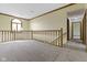 Open hallway with natural light from the window and carpet at 960 Arrowwood Dr, Carmel, IN 46033
