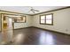 Living room showing hardwood floors and an opening into the kitchen at 960 Arrowwood Dr, Carmel, IN 46033