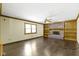 Carpeted living room featuring a brick fireplace, built-in shelving, and natural light at 960 Arrowwood Dr, Carmel, IN 46033