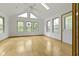 Bright living room boasts hardwood floors, vaulted ceilings, and large windows at 960 Arrowwood Dr, Carmel, IN 46033