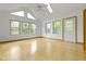 Bright living room boasts hardwood floors, vaulted ceilings, and large windows at 960 Arrowwood Dr, Carmel, IN 46033