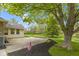 Beautiful brick patio with adjacent American flag and a well-manicured lawn at 960 Arrowwood Dr, Carmel, IN 46033