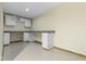 Bright bonus room with white cabinets, drawers, and a neutral countertop at 960 Arrowwood Dr, Carmel, IN 46033