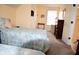 Comfortable bedroom featuring two beds, closet space, and neutral-toned walls for a peaceful retreat at 10691 Morristown Ct, Carmel, IN 46032