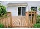 Spacious wooden deck, ideal for outdoor gatherings, with a sliding glass door into the home at 10691 Morristown Ct, Carmel, IN 46032