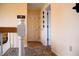 Hallway from upstairs featuring a rug, tan walls, and doors that allow for privacy and flow at 10691 Morristown Ct, Carmel, IN 46032