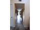 Hallway with marble floors featuring doorways and decorations along the walls at 10691 Morristown Ct, Carmel, IN 46032