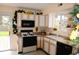 Cozy kitchen with white cabinets, functional appliances, and cheerful decor at 10691 Morristown Ct, Carmel, IN 46032