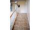 Tiled staircase with white banister and wooden handrail creates a classic and elegant design at 10691 Morristown Ct, Carmel, IN 46032