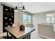 Inviting loft area with a large window, chalkboard, and a wooden table perfect for crafts or study at 10818 Soda Creek Ct, Indianapolis, IN 46239