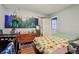 Bright bedroom with sunflower-themed bedding and adjacent room visible through an open doorway at 1121 Eugene St, Indianapolis, IN 46208