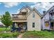 Charming two-story home with a cozy front porch and an inviting second-floor balcony at 1121 Eugene St, Indianapolis, IN 46208