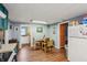 Kitchen includes a dining area and features a refrigerator and access to other rooms at 1121 Eugene St, Indianapolis, IN 46208