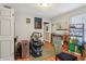 Multi-purpose room with laminate flooring, an open door, and various items throughout at 1121 Eugene St, Indianapolis, IN 46208