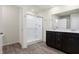 Bathroom with a glass shower and dark cabinets with a double sink at 113 Hunter'S Rdg Dr, Danville, IN 46122