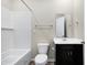 Clean bathroom with a tub-shower combo, white subway tile, and dark vanity at 113 Hunter'S Rdg Dr, Danville, IN 46122