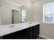 Bathroom featuring a double sink vanity and a large mirror at 113 Hunter'S Rdg Dr, Danville, IN 46122