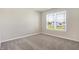Bedroom features plush carpet, neutral walls, and a window at 113 Hunter'S Rdg Dr, Danville, IN 46122