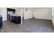 Open concept view of kitchen and living area with dark cabinets and hardwood floors at 113 Hunter'S Rdg Dr, Danville, IN 46122