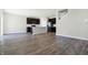 Spacious open-concept kitchen with stainless steel appliances and stylish dark cabinetry at 113 Hunter'S Rdg Dr, Danville, IN 46122