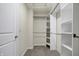 Walk-in closet with carpet and closet system at 113 Hunter'S Rdg Dr, Danville, IN 46122