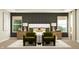 Contemporary bedroom with a dark accent wall, plush chairs, and ambient lighting, creating a relaxing atmosphere at 11528 Aubrey Ln, Fishers, IN 46040