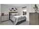 Stylish ' bedroom with dinosaur themed decor, a comfortable bed, and a street view window at 11612 Aubrey Ln, Fishers, IN 46040